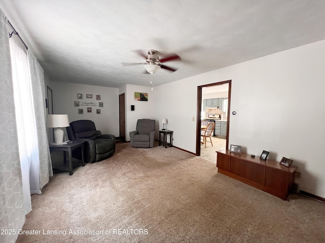 709 N Mead St, Saint Johns, MI 48879 - living area featuring carpet, a ceiling fan, and healthy amount of natural light