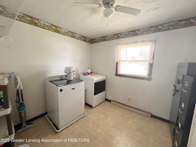 709 N Mead St, Saint Johns, MI 48879 - laundry area with separate washer and dryer, baseboard heating, ceiling fan, a textured ceiling, and light flooring