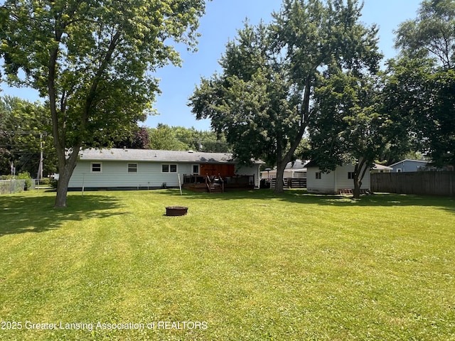 709 N Mead St, Saint Johns, MI 48879 - view of yard with a wooden deck