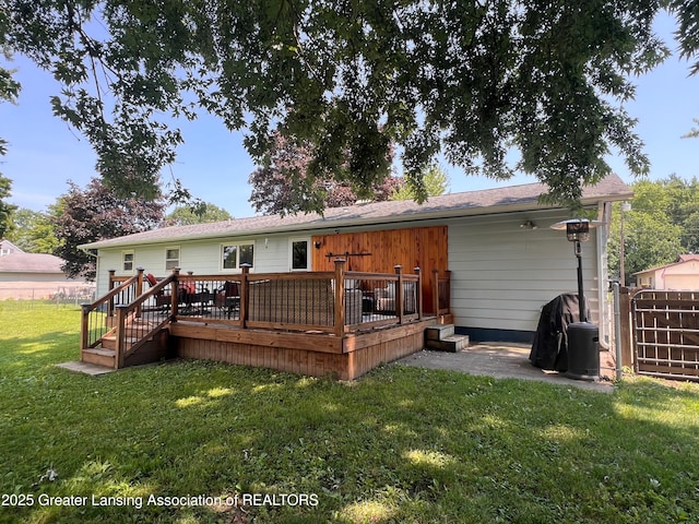 709 N Mead St, Saint Johns, MI 48879 - rear view of house featuring a deck and a gate