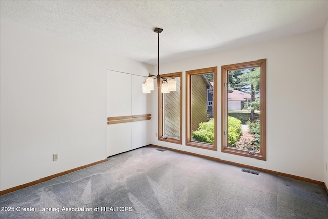 2575 Capeside Dr, Okemos, MI 48864 - carpeted empty room featuring baseboards and a textured ceiling