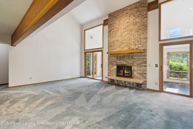 2575 Capeside Dr, Okemos, MI 48864 - unfurnished living room featuring high vaulted ceiling, carpet flooring, and a fireplace