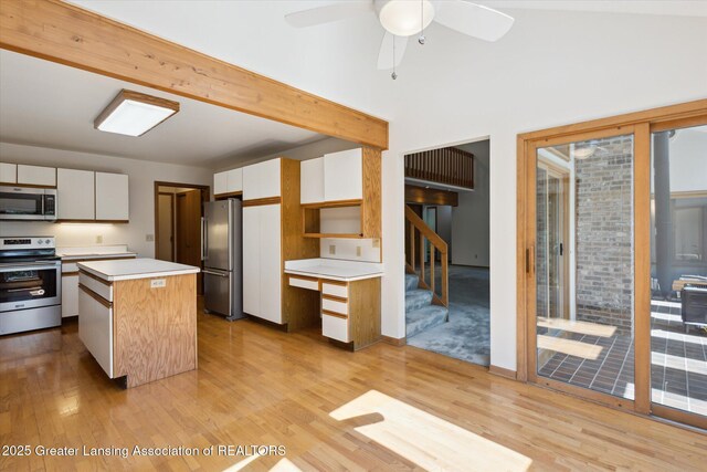 2575 Capeside Dr, Okemos, MI 48864 - kitchen featuring appliances with stainless steel finishes, light wood finished floors, light countertops, and ceiling fan