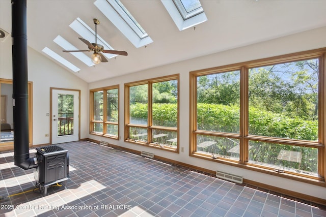 2575 Capeside Dr, Okemos, MI 48864 - unfurnished sunroom with a wood stove, a skylight, and lofted ceiling