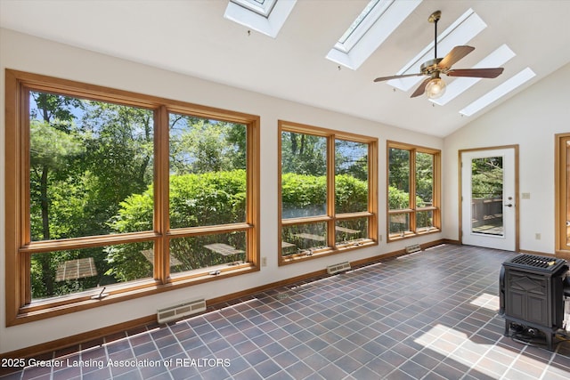 2575 Capeside Dr, Okemos, MI 48864 - unfurnished sunroom with a skylight, lofted ceiling, and a wood stove