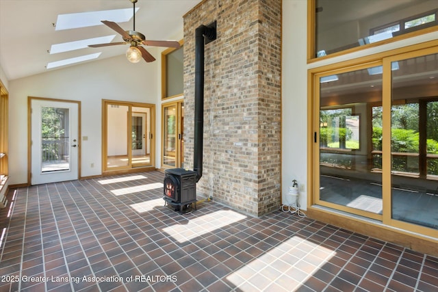 2575 Capeside Dr, Okemos, MI 48864 - unfurnished sunroom with a wood stove, healthy amount of natural light, lofted ceiling, a skylight, and french doors
