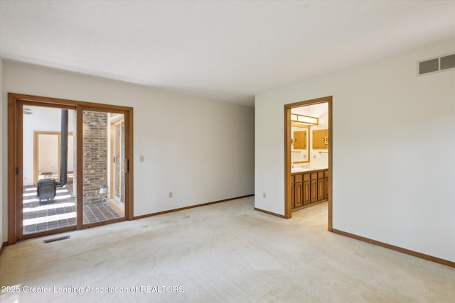 2575 Capeside Dr, Okemos, MI 48864 - empty room with light colored carpet and healthy amount of natural light