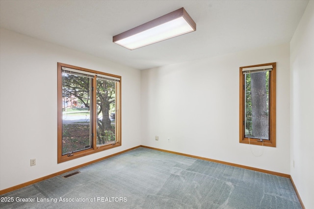 2575 Capeside Dr, Okemos, MI 48864 - unfurnished room featuring healthy amount of natural light and carpet