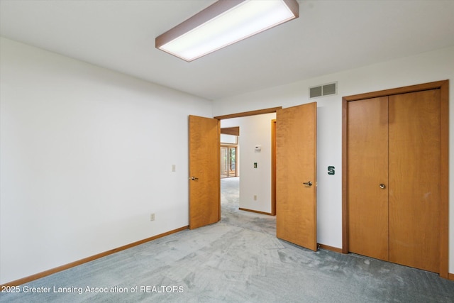 2575 Capeside Dr, Okemos, MI 48864 - unfurnished bedroom with light carpet and a closet