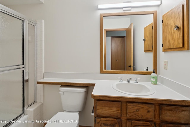 2575 Capeside Dr, Okemos, MI 48864 - bathroom featuring vanity and shower / bath combination with glass door