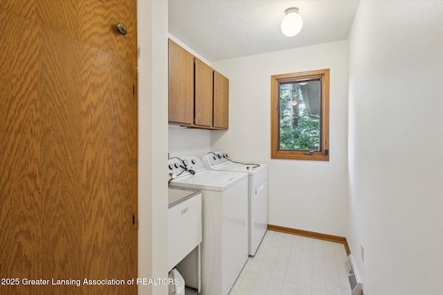 2575 Capeside Dr, Okemos, MI 48864 - washroom featuring independent washer and dryer and cabinet space