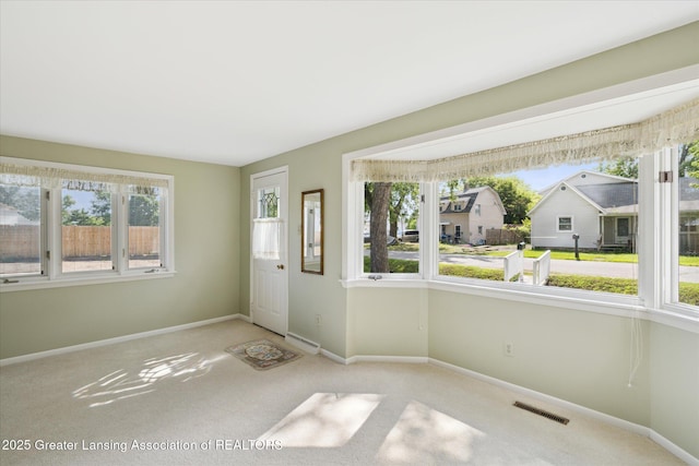 873 Union Ave, Owosso, MI 48867 - unfurnished sunroom featuring healthy amount of natural light