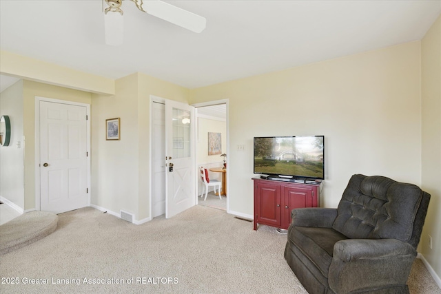 873 Union Ave, Owosso, MI 48867 - living area featuring light carpet and a ceiling fan