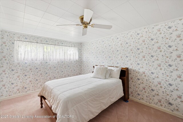 873 Union Ave, Owosso, MI 48867 - bedroom with multiple windows, carpet, wallpapered walls, crown molding, and a ceiling fan
