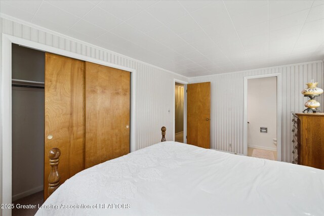 873 Union Ave, Owosso, MI 48867 - bedroom with ornamental molding and a closet