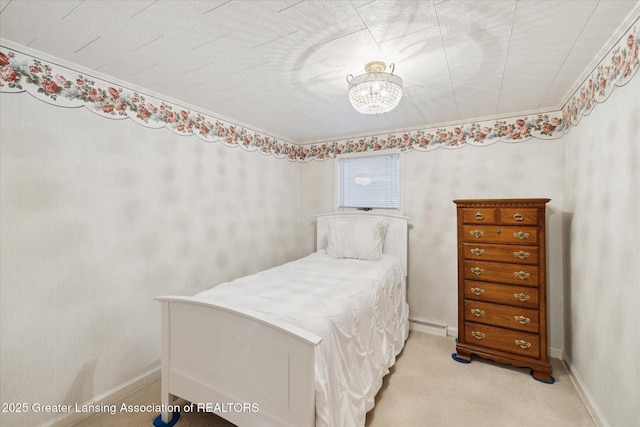 873 Union Ave, Owosso, MI 48867 - carpeted bedroom with a chandelier, ornamental molding, and baseboard heating