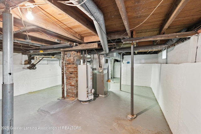 873 Union Ave, Owosso, MI 48867 - unfinished basement featuring water heater and heating unit