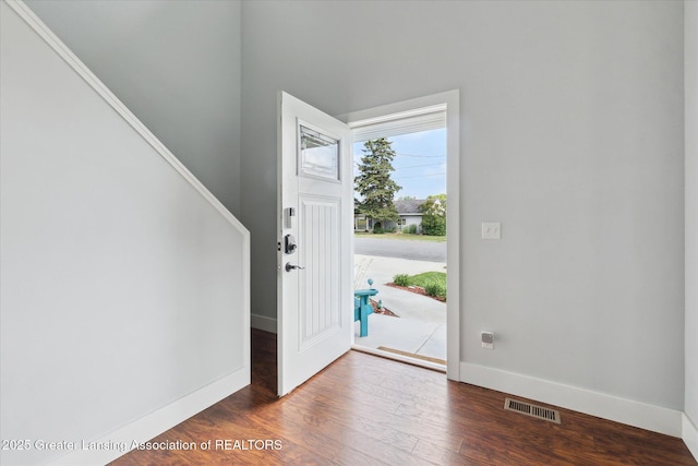 112 E Barber St, Ithaca, MI 48847 - entryway featuring wood finished floors and stairs
