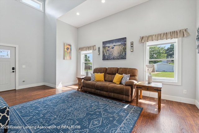 112 E Barber St, Ithaca, MI 48847 - living area with a towering ceiling, healthy amount of natural light, wood finished floors, and recessed lighting