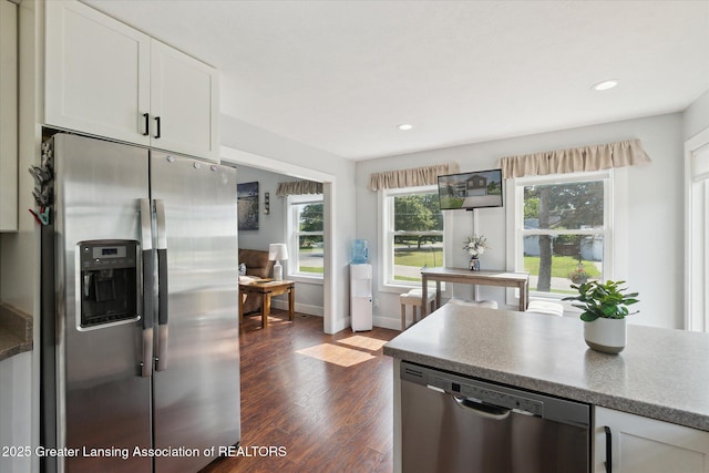 112 E Barber St, Ithaca, MI 48847 - kitchen with stainless steel appliances, dark wood-style floors, white cabinetry, and recessed lighting
