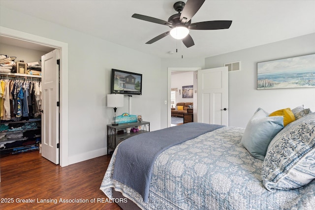 112 E Barber St, Ithaca, MI 48847 - bedroom with wood finished floors, a spacious closet, and a ceiling fan