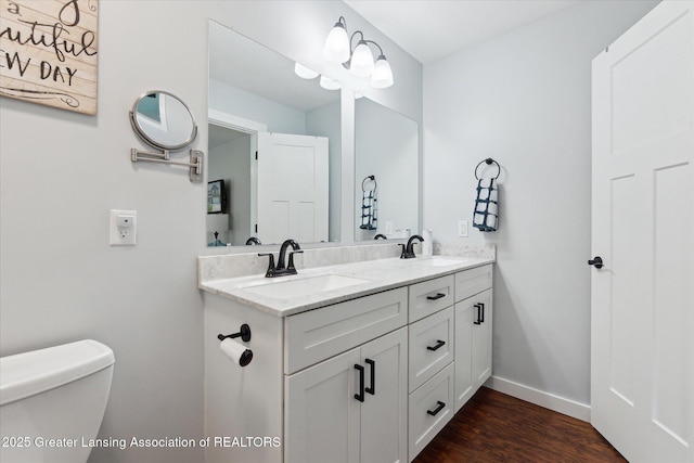 112 E Barber St, Ithaca, MI 48847 - full bath featuring double vanity and wood finished floors