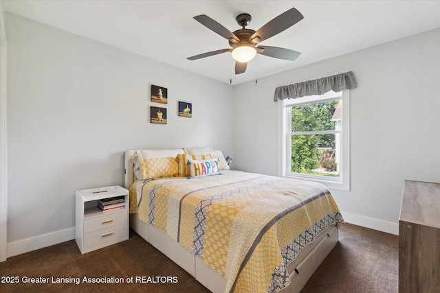 112 E Barber St, Ithaca, MI 48847 - bedroom with dark colored carpet and ceiling fan