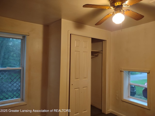 518 Clark St, Eaton Rapids, MI 48827 - unfurnished bedroom featuring a closet and ceiling fan