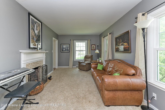 720 Linden St, East Lansing, MI 48823 - living area with light carpet, a brick fireplace, and plenty of natural light