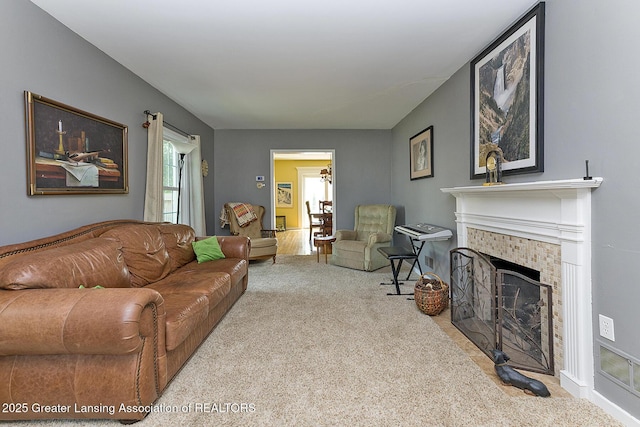 720 Linden St, East Lansing, MI 48823 - carpeted living room with a tile fireplace