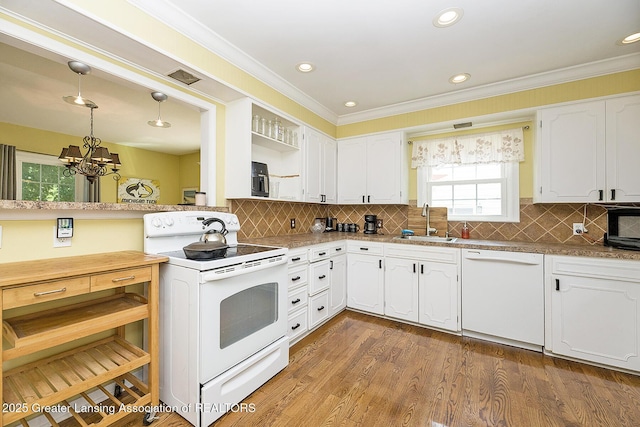720 Linden St, East Lansing, MI 48823 - kitchen featuring white appliances, open shelves, a chandelier, white cabinetry, and backsplash