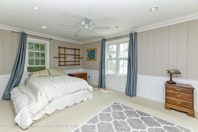 720 Linden St, East Lansing, MI 48823 - carpeted bedroom with ornamental molding, a decorative wall, multiple windows, recessed lighting, and a ceiling fan
