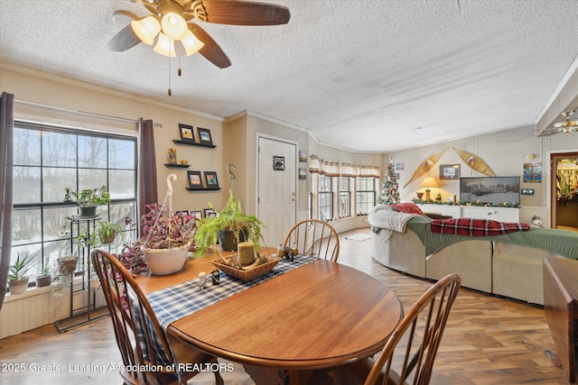 9428 S Wright Rd, Eagle, MI 48822 - dining space with ceiling fan, a textured ceiling, wood finished floors, and ornamental molding