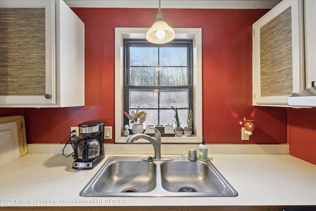 9428 S Wright Rd, Eagle, MI 48822 - kitchen featuring light countertops and decorative light fixtures