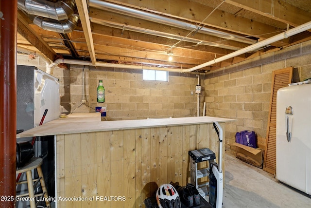 9428 S Wright Rd, Eagle, MI 48822 - basement featuring freestanding refrigerator