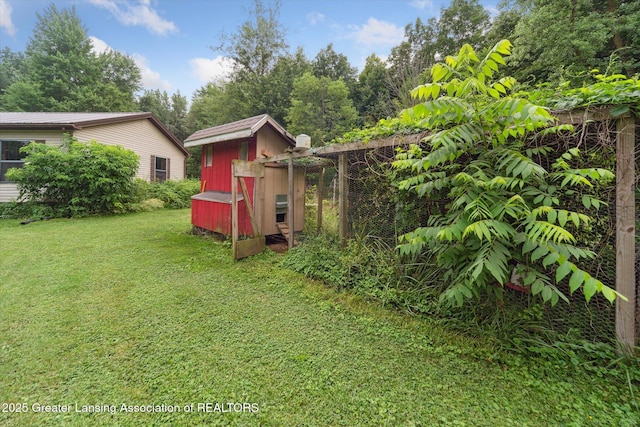 9428 S Wright Rd, Eagle, MI 48822 - view of green lawn with exterior structure and an outbuilding