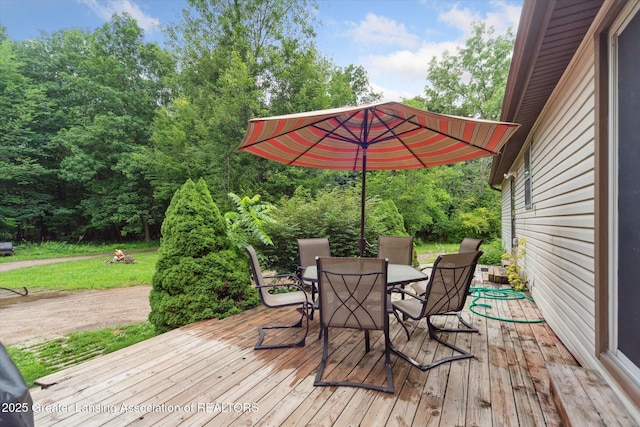 9428 S Wright Rd, Eagle, MI 48822 - wooden terrace with outdoor dining area