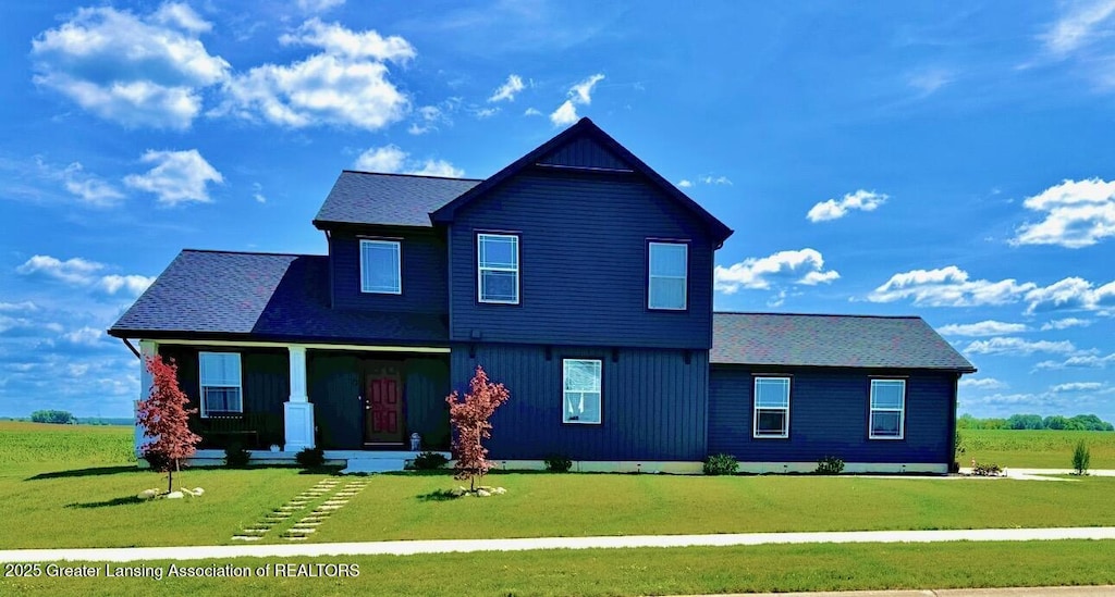 195 Jade Ct, Alma, MI 48801 - view of front of home featuring a front lawn, covered porch, and roof with shingles