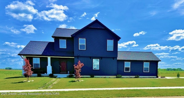 195 Jade Ct, Alma, MI 48801 - view of front of home featuring a front lawn, covered porch, and roof with shingles