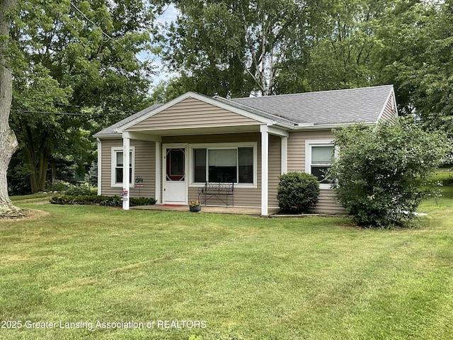 315 Oyer St, Springport, MI 49284 - view of front of house with a front yard and roof with shingles
