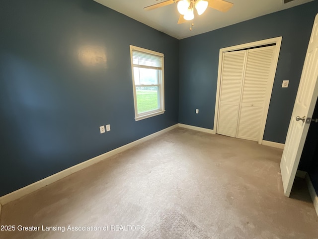 315 Oyer St, Springport, MI 49284 - unfurnished bedroom with a closet, carpet floors, and a ceiling fan