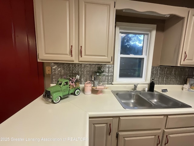 315 Oyer St, Springport, MI 49284 - kitchen with light countertops, decorative backsplash, and white cabinets