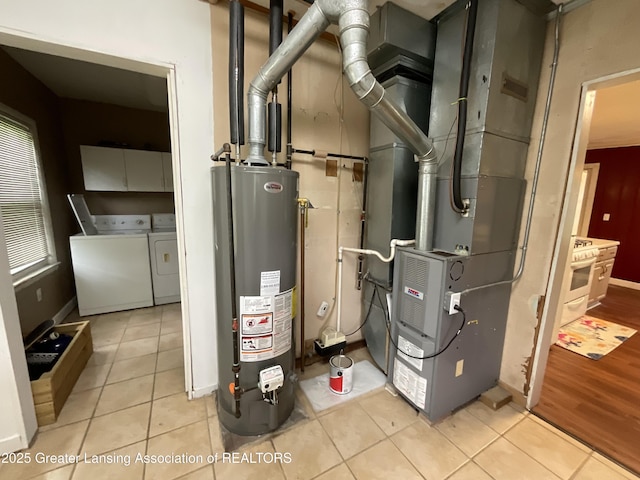315 Oyer St, Springport, MI 49284 - utility room with water heater and washer and clothes dryer
