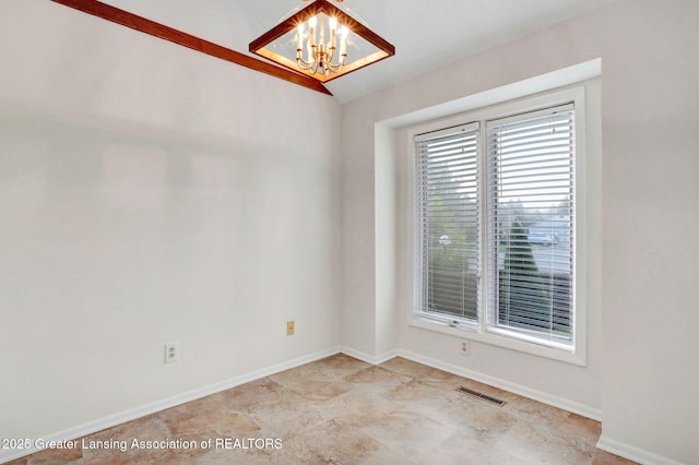 1621 Willow Creek Dr, Lansing, MI 48917 - empty room with a chandelier and lofted ceiling