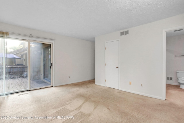 1621 Willow Creek Dr, Lansing, MI 48917 - carpeted spare room with baseboards and a textured ceiling