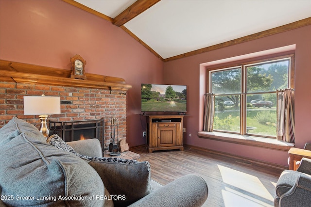 9303 Blueberry Ct, Howell, MI 48843 - living room featuring wood finished floors and a brick fireplace