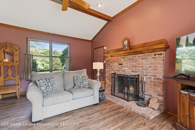 9303 Blueberry Ct, Howell, MI 48843 - living area featuring wood finished floors, a brick fireplace, and ceiling fan