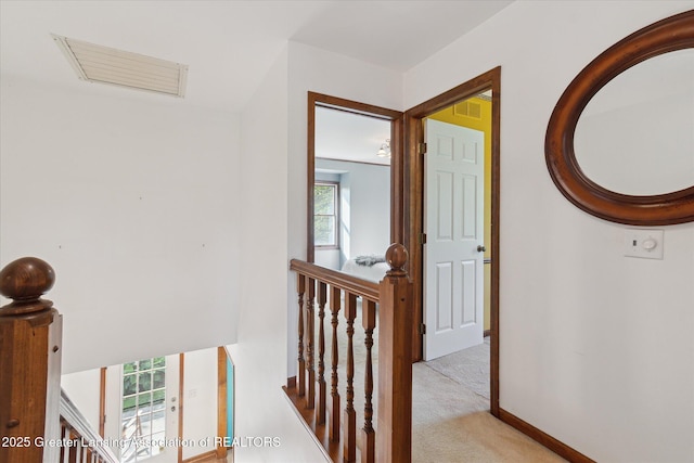 9303 Blueberry Ct, Howell, MI 48843 - hall with an upstairs landing and carpet floors