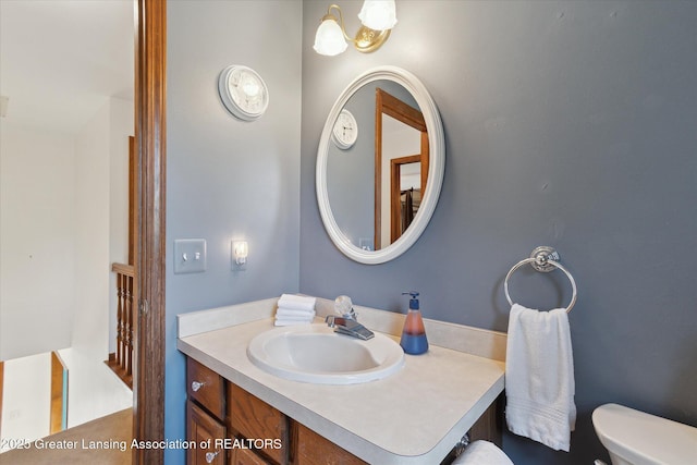 9303 Blueberry Ct, Howell, MI 48843 - bathroom featuring vanity and toilet