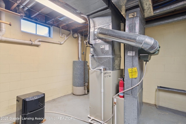 9303 Blueberry Ct, Howell, MI 48843 - utility room featuring water heater and heating unit